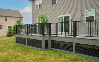 Brand-new deck built with grey composite deck boards and complimentary black aluminum railing in Bonney Lake, WA