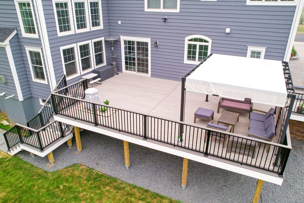Large Raised Composite Deck With Striking Black Aluminum Railing And Custom Staircase In Sammamish, Wa