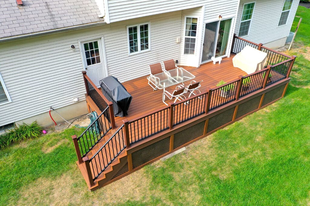 Composite Deck Resurfacing Project With Dark Aluminum Rails And Attractive Lattice Skirting In The Same Color As The Deck In Snohomish, Wa