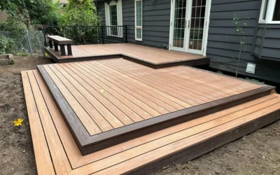 A newly installed deck with light wood decking and modern black railings, enhancing the outdoor living space.