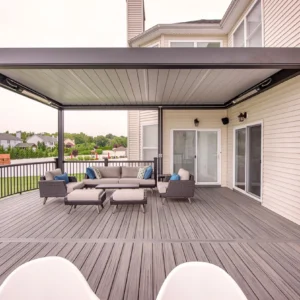 A spacious outdoor deck with a sleek louvered roof and modern seating arrangement, highlighting deck installation trends