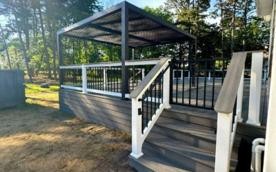 A freestanding deck with a pergola and stairs, showcasing the process to anchor a freestanding deck for stability.