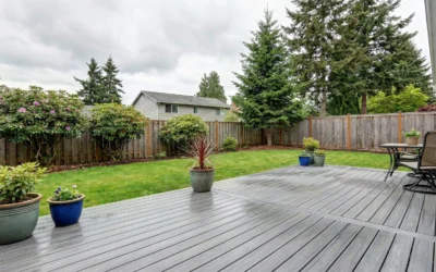 Expansive grey patio with potted plants demonstrating that light-colored composite decks stay cooler.