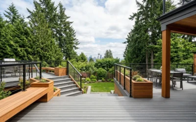 Custom multi-level composite deck with cedar accents and city skyline view built by a professional deck builder Seattle.