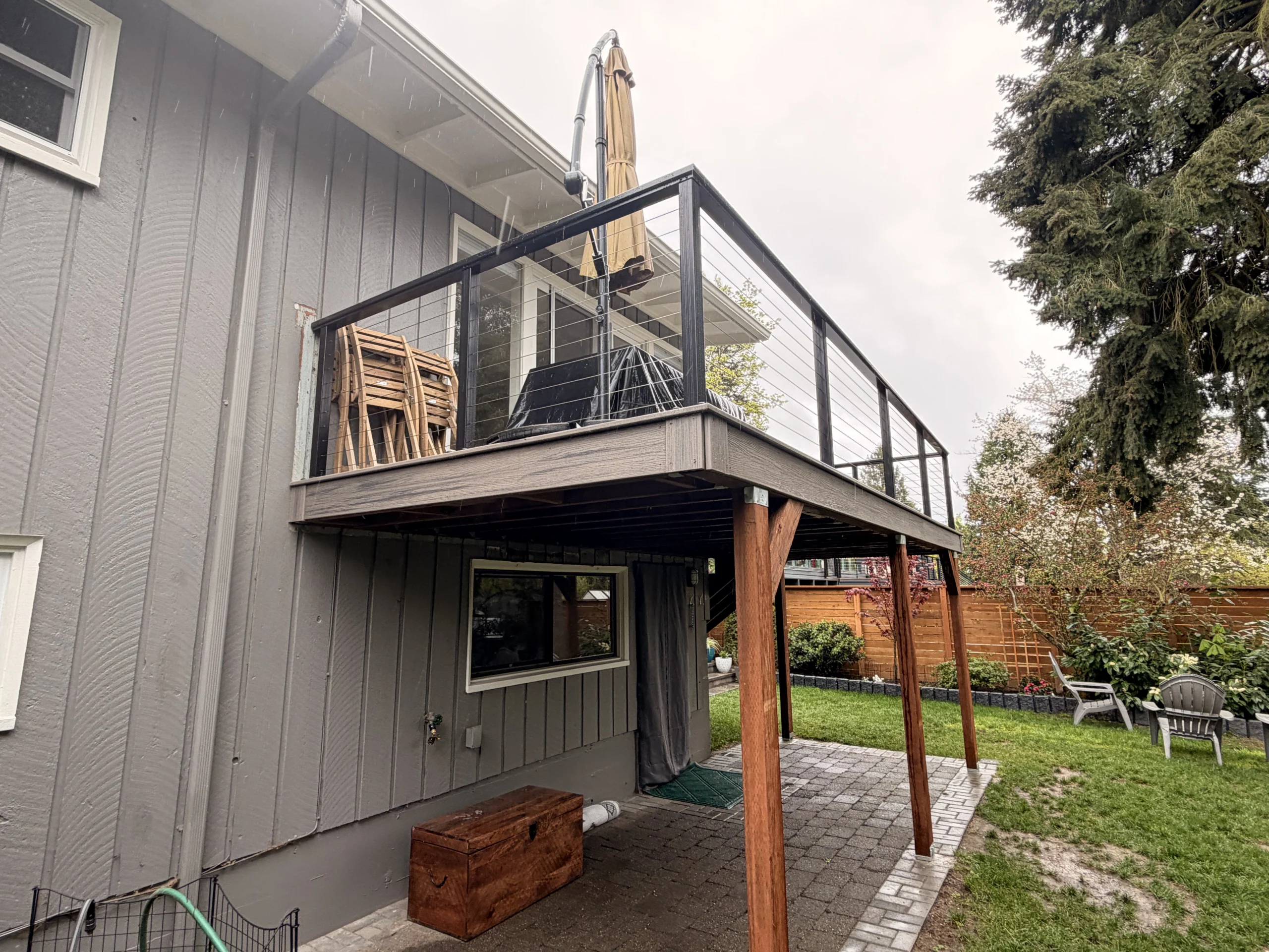 Raised composite platform with cable railing from a second story deck installation seattle wa.