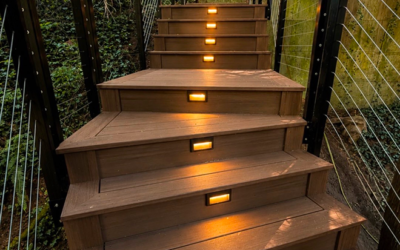 Illuminated Outdoor Composite Stairs With Step Lights And Cable Railings.