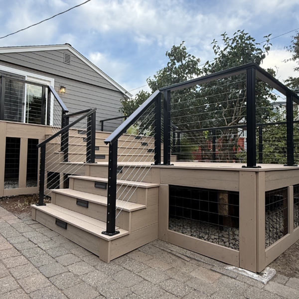 Second-story Trex deck replacement Close View Of Composite Deck Steps With Led Riser Lights, Cable Railings, And Protective Wire Mesh Skirting.