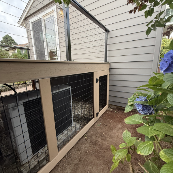 Second-story Trex deck replacement Wire Mesh Panel Enclosure Under A Composite Deck Built Around An Outdoor Hvac Heat Pump Unit.