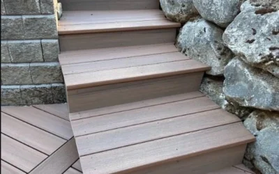View Looking Up New Durable Composite Steps Built Between A Stacked Block Wall And A Boulder Retaining Wall, Replacing Old Wood.